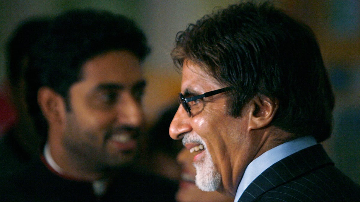 Bollywood actor Amitabh Bachchan and his son Abhishek Bachchan are in trouble for  wearing the Indian flag during the Cricket World Cup 2015. (Photo: Reuters)