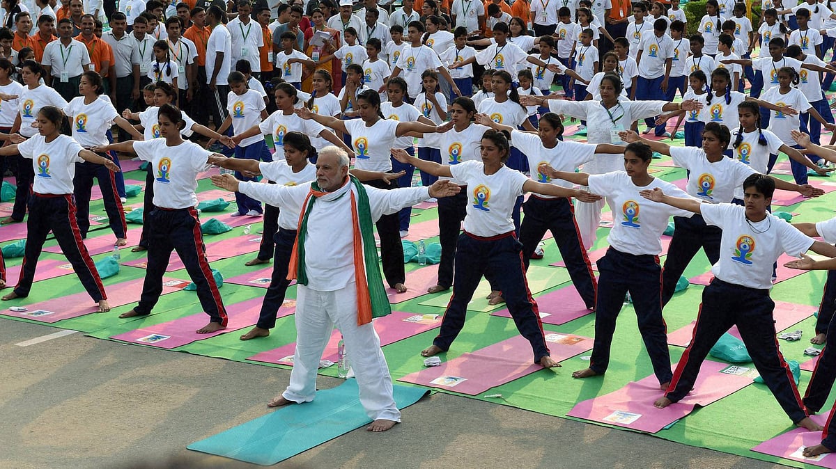 Prime Minister Narendra Modi performs yoga, along with thousands of others, at a mass yoga session to mark the International Day of Yoga 2015. (Photo: PTI)