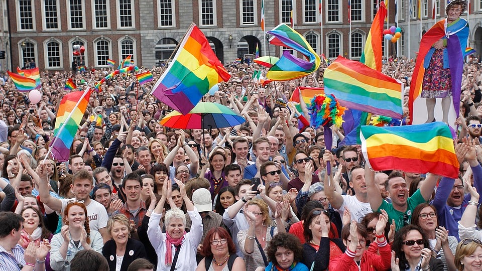 A man waves a rainbow flag during the annual Gay Pride Parade. (Photo: AP)