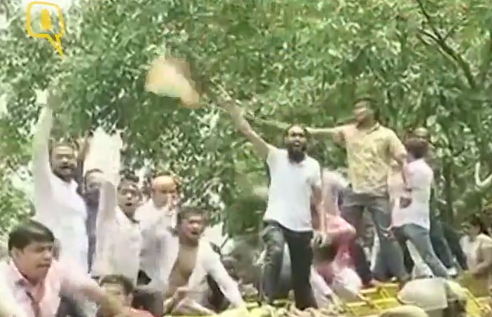 BJP workers protest against the poer tariff hike in Delhi. (Photo: ANI screengrab)