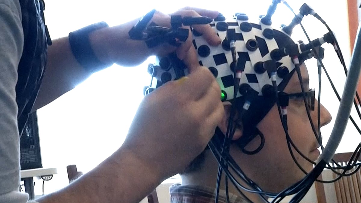 Researchers at the Yale Brain Function Lab in Connecticut attach laser probes to specially designed caps to see how the brain works. (Photo: AP)