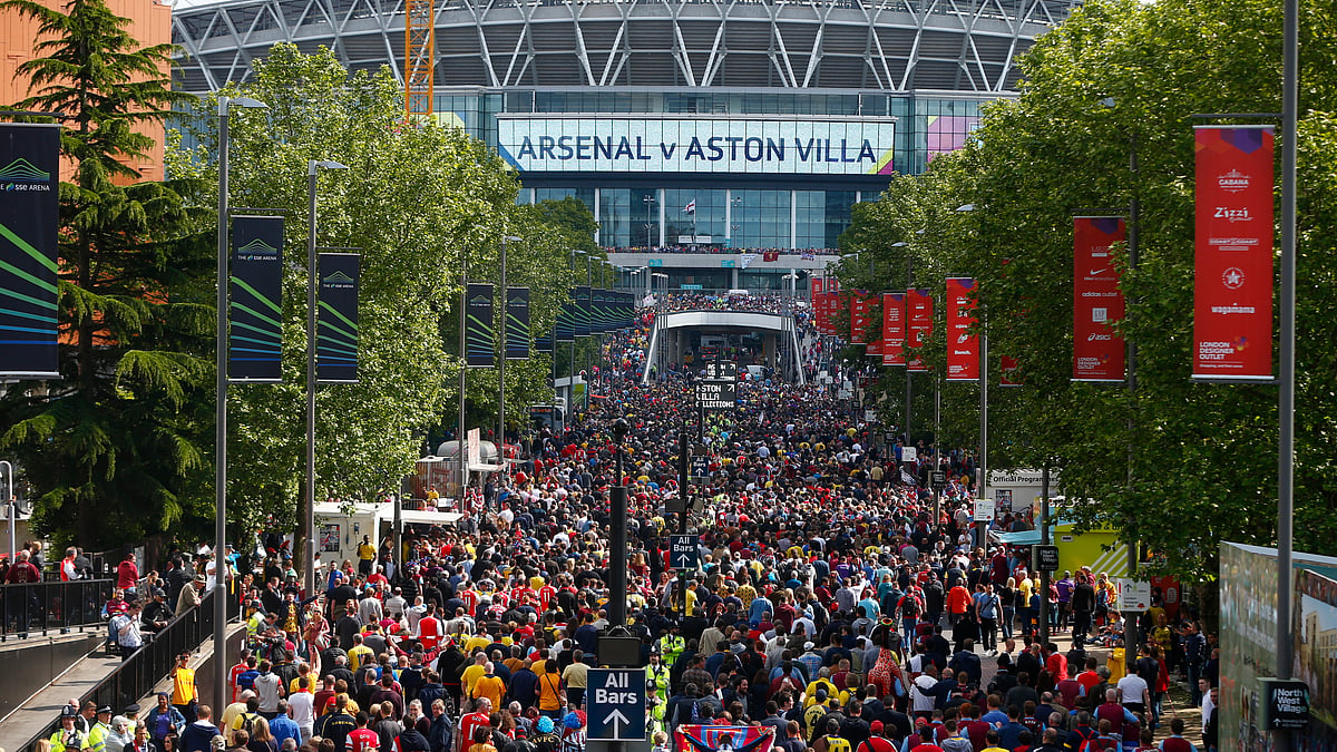 Fans of Arsenal and Aston Villa line-up to enter the stadium to watch the FA Cup Final in May. (Photo: Reuters)