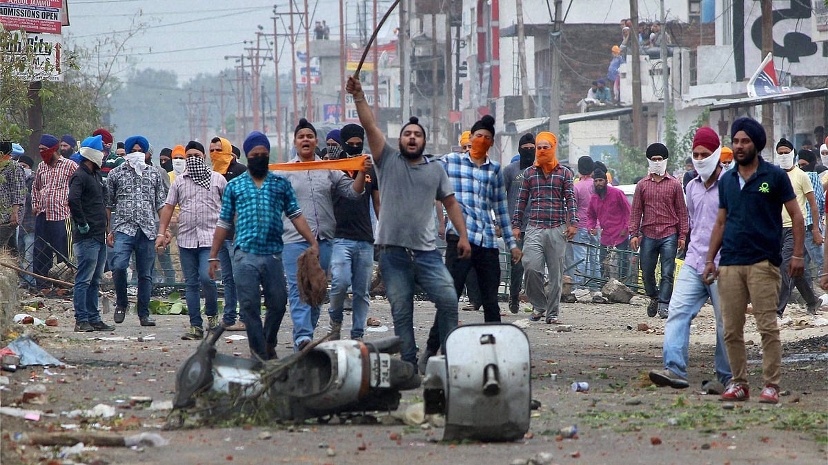 Angry  protesters during a clash with police&nbsp;at Rani Ragh near the airport in Jammu. (Photo: PTI)&nbsp;