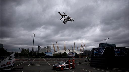 Australia’s Steve Sommerfeld performs a jump on his motocross bike backdropped by the O2 Arena in London. (Photo: AP)