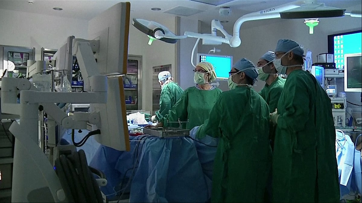 Stock photo of doctors performing surgery. 