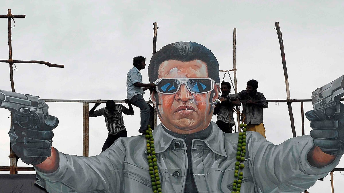 Fans pour milk over a cut out of Tamil superstar Rajinikanth from the film <i>Enthiran </i>(Photo: Reuters)