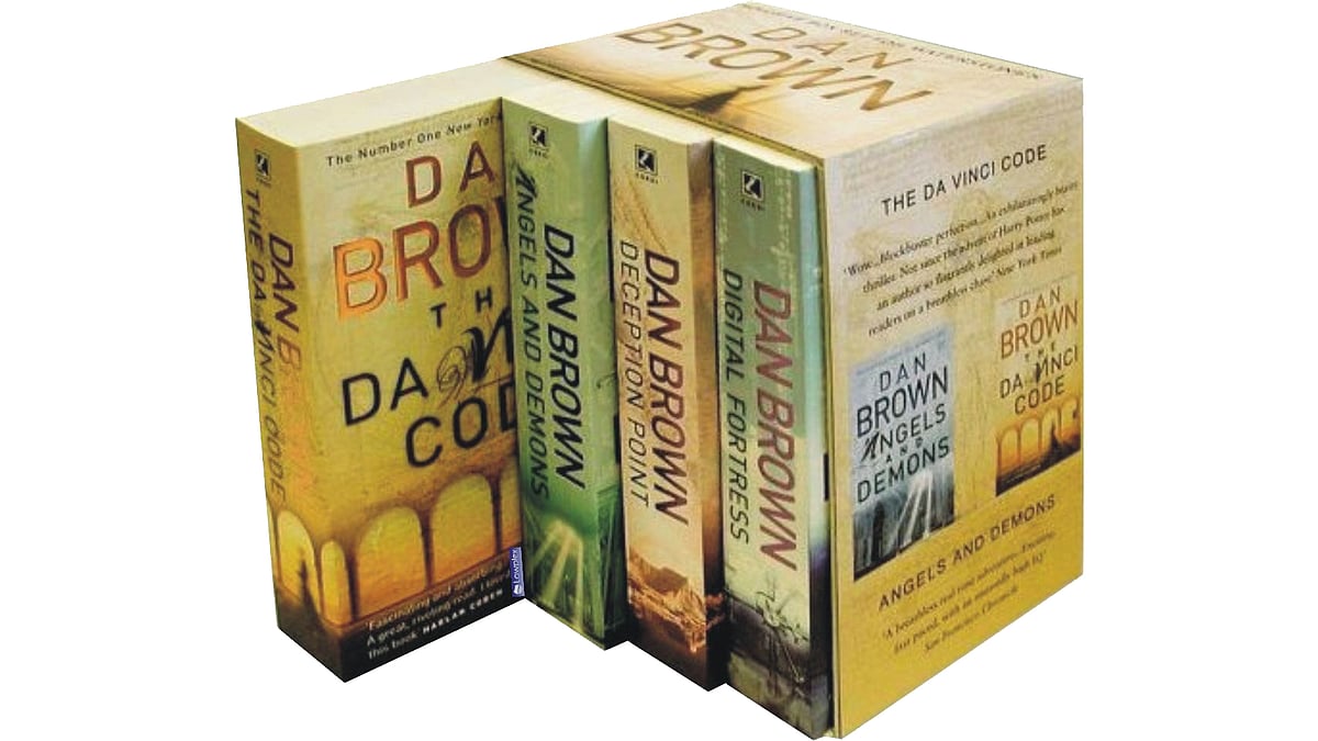 Collection of Dan Brown’s books. (Photo Courtesy: <a href="http://www.bookbundles.co.uk/ekmps/shops/plodit/images/dan-brown-robert-langdon-4-books-collection-set-78776-p.jpg">Wikimedia Commons</a>)