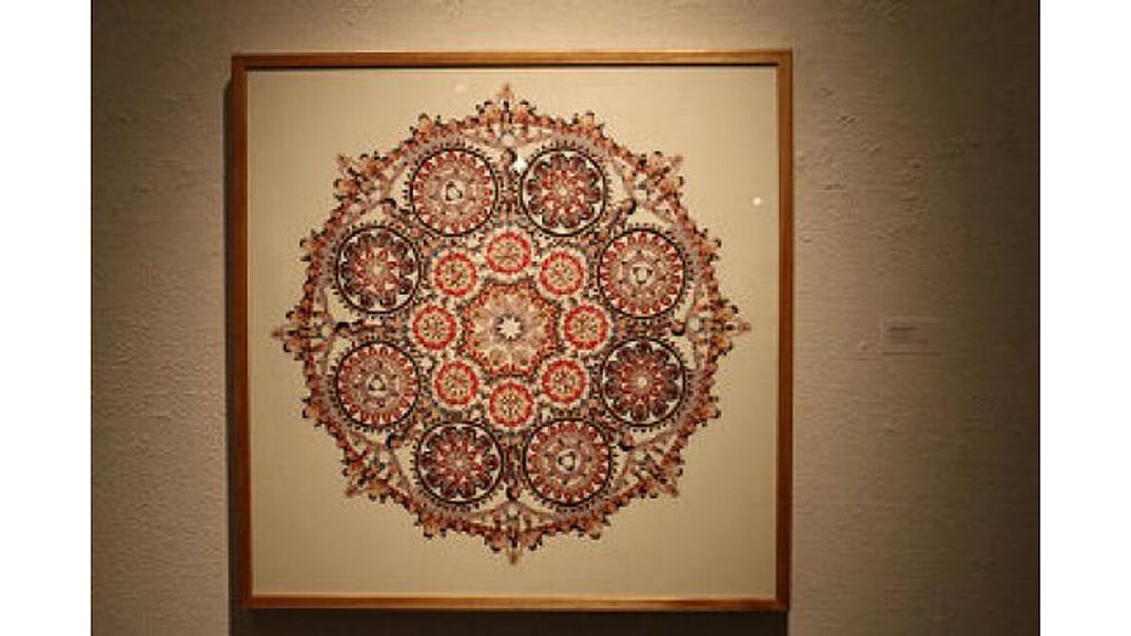 The collage looks like a cathedral window. But a closer look shows people in sexual positions. (Photo: <a href="http://www.thestar.com/news/queenspark/2015/07/16/government-office-no-place-for-sexually-explicit-art-ontario-tories-say.html">The Star</a>)
