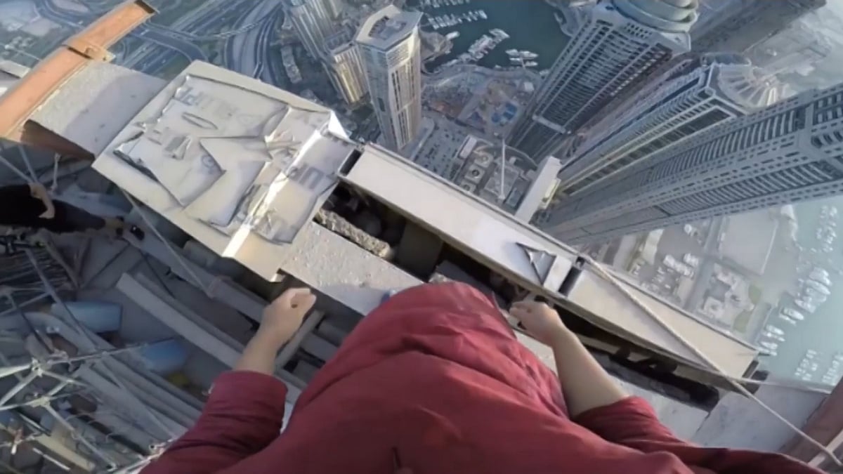 Three friends scale a 1000-foot tower in Dubai without any safety equipment. (Photo: AP screen grab)