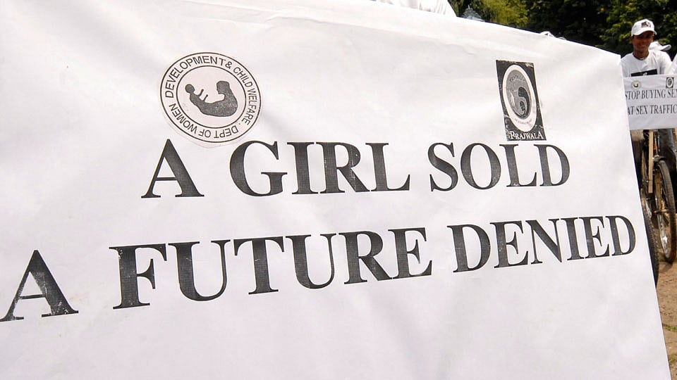 Cyclists are seen near a placard during a cycle rally to oppose the demand for prostitution, in the southern Indian city of Hyderabad. Representational Image. (Photo: Reuters)