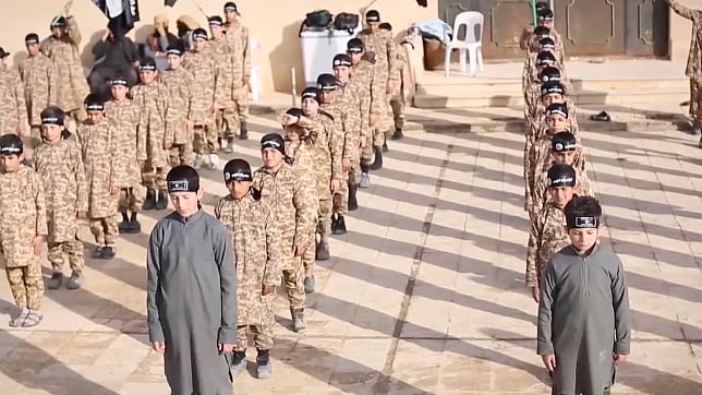 ISIS teaches children the skill of beheading. (Photo: AP screengrab)