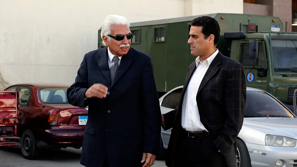 Ahmed Nazif with his son in 2014. (Photo: Reuters)