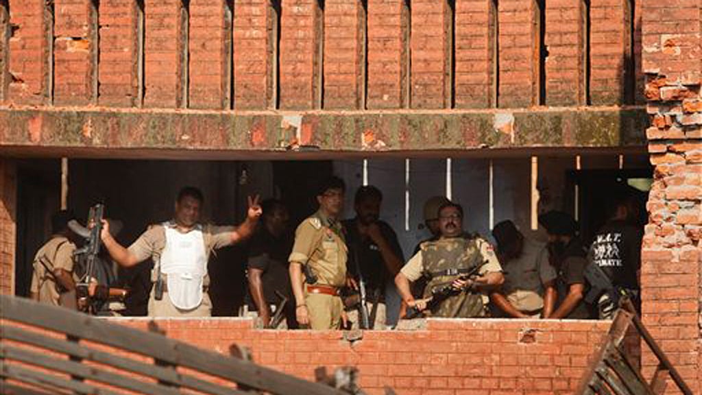 Time for some introspection perhaps? A police officer flashing a victory sign after the end of a gun battle with terrorists, Dinanagar, Punjab, July 27, 2015. (Photo courtesy: AP)