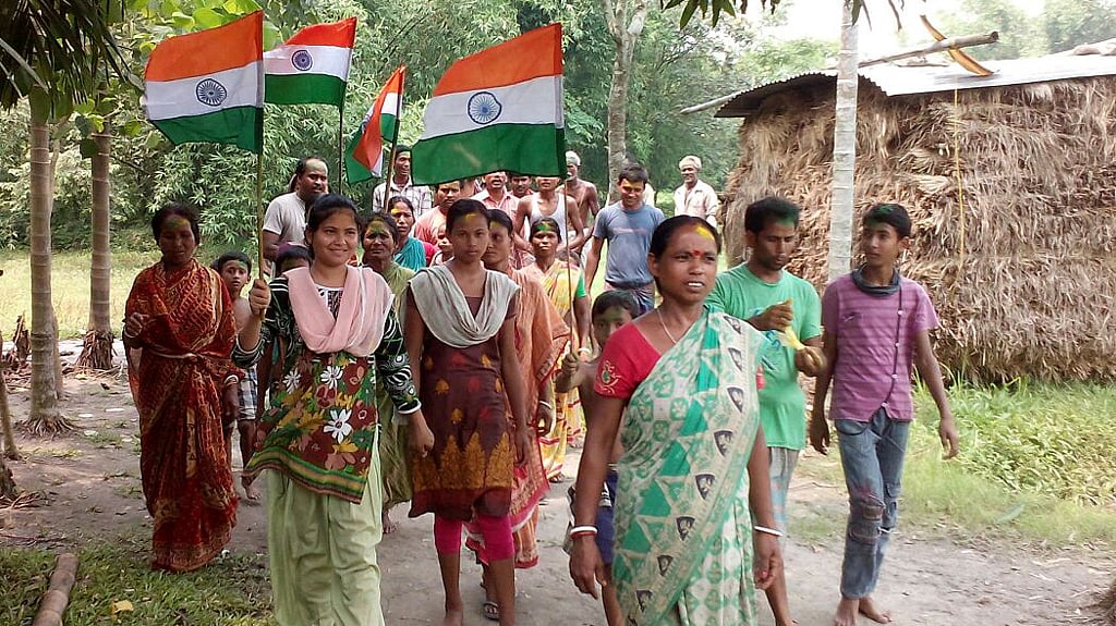 A section of Indians living in enclaves in Bangladesh walk through their village, making clear which side of the border their loyalties lie. (Photo: BBEECC, Bharat Bangladesh Enclaves Exchange Coordination Committee)