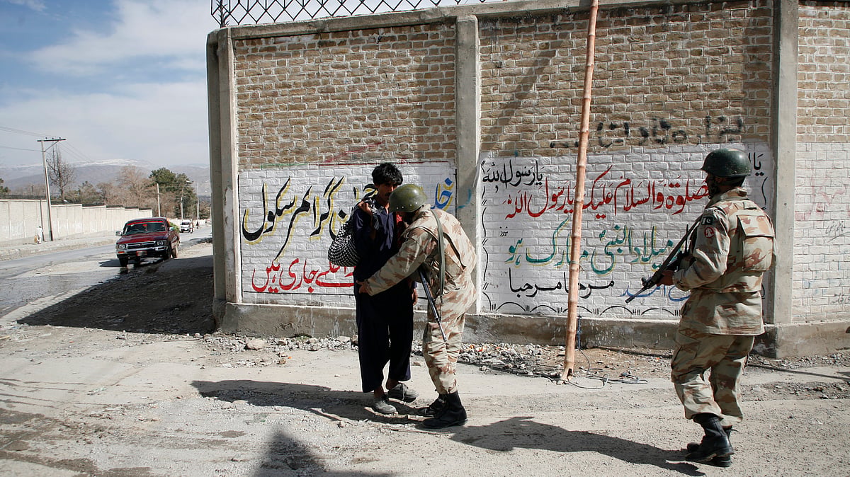 File image of Pakistani Paramilitary soldiers searching a man from the Hazara community in Quetta after Lashkar-e-Jhangvi’s sectarian attack on Shias which killed 80 people in Quetta on February 16, 2013. (Photo: Reuters)