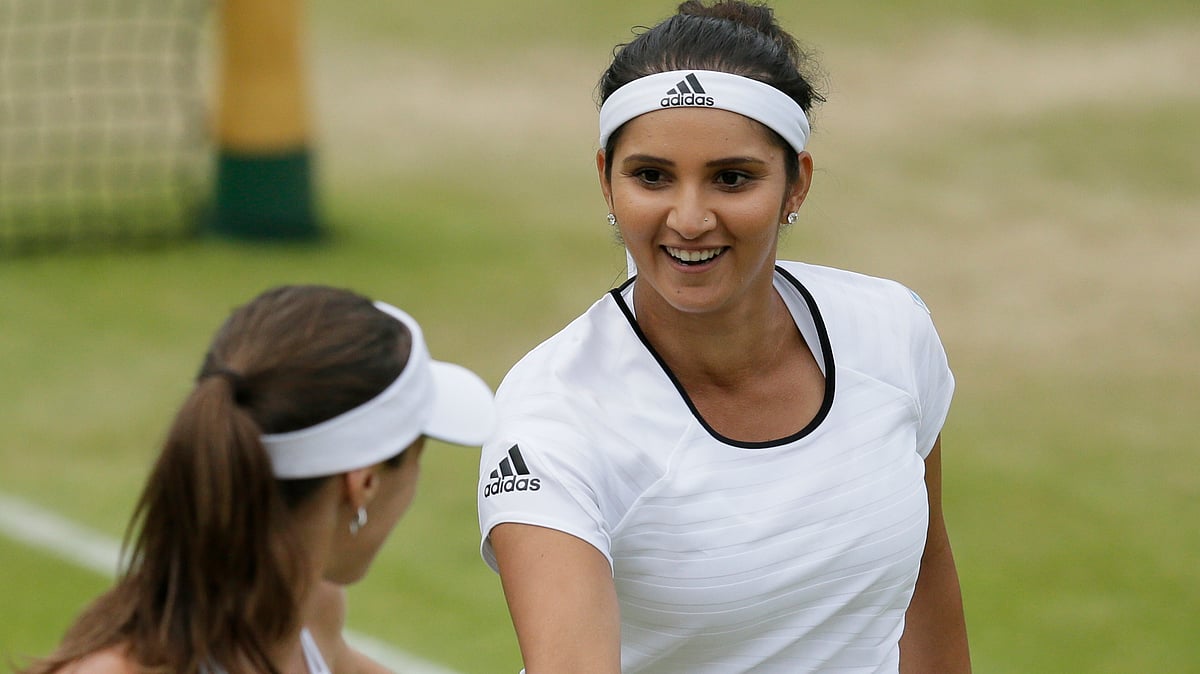 Martina Hingis and Sania Mirza  will play the women’s doubles final on Saturday night at Wimbledon. (Photo: AP)