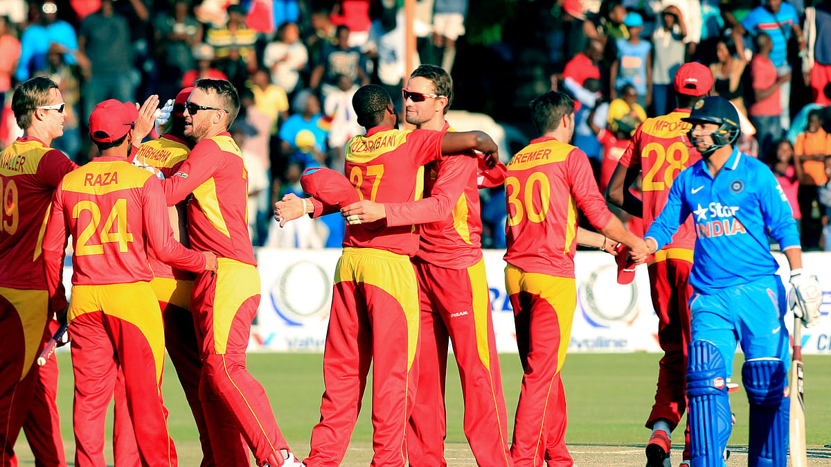 Zimbabwean players celebrate after beating India in their Twenty20 cricket match in Harare. (Photo: AP)<a></a>