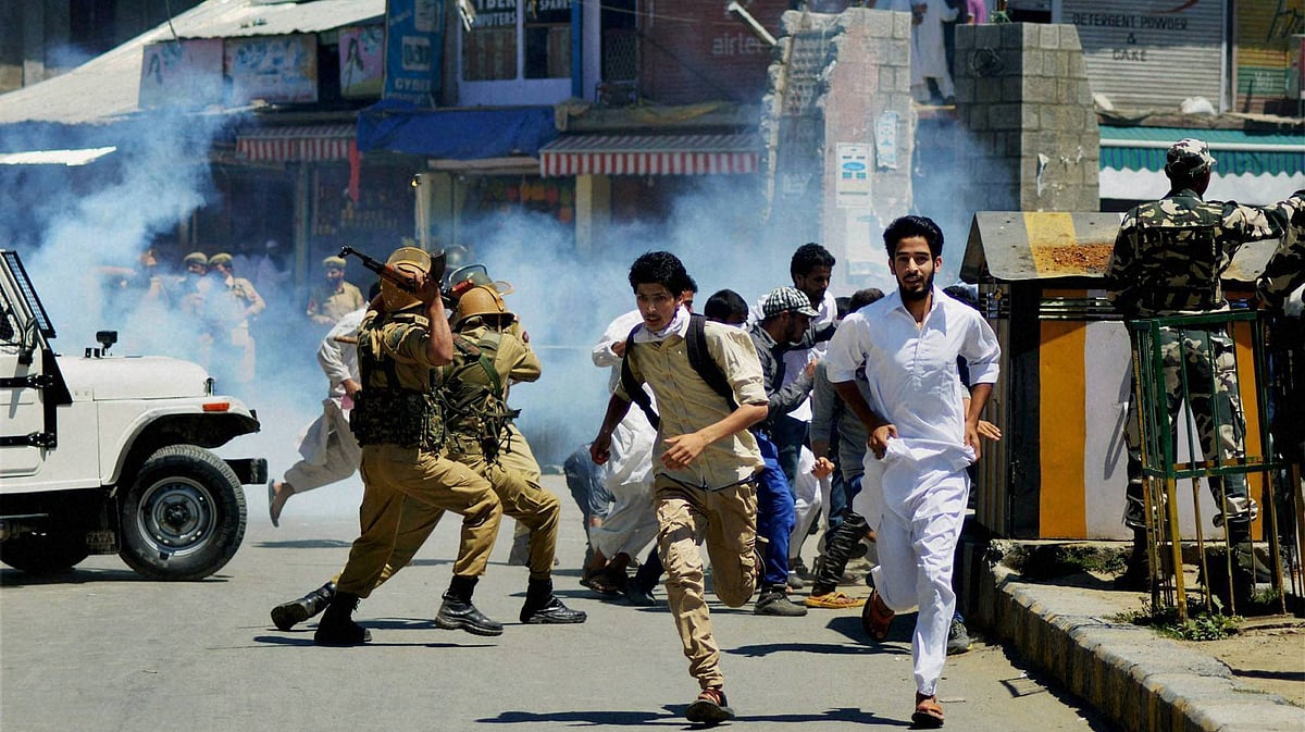 Jammu and Kashmir police and security forces during clashes with protesters in Anantnag on Friday. (Photo: PTI)