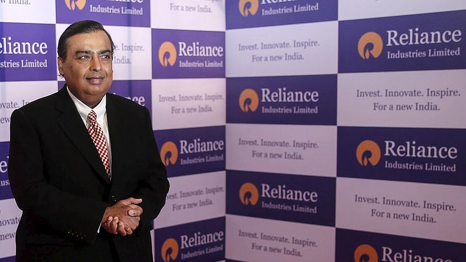 Mukesh Ambani, chairman of Reliance Industries Limited, poses for photographers before addressing the annual shareholders meeting in Mumbai, India, June 12, 2015. 