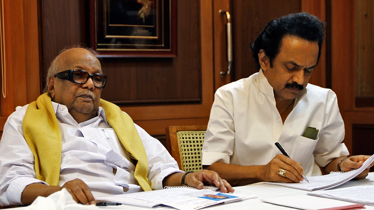 M Karunanidhi (left) former Tamil Nadu Chief Minister and leader of Dravida Munnetra Kazhagam (DMK) party attends a meeting besides his son MK Stalin, a DMK leader. 