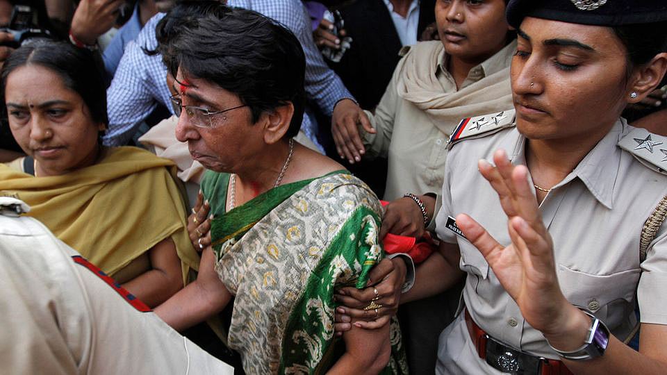 Maya Kodnani, former Gujarat minister, being escorted to prison by police after a court hearing in Ahmedabad in 2014 after conviction in the Naroda Patiya case. 