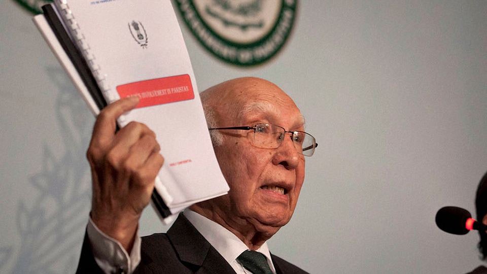 Pakistan’s National Security Adviser Sartaj Aziz shows dossiers about Indian intelligence agency “RAW’s involvement in promoting terrorism in Pakistan during a press conference in Islamabad, Pakistan. (Photo: PTI)