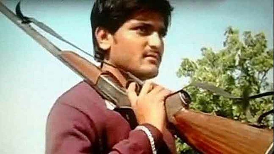 Hardik Patel, 22, is the “face” of the Patel agitation for reservation. He says images of him with guns in propaganda videos is only for dramatic effect and not to advocate violence. (Photo Courtesy: Screen grab from <a href="https://www.youtube.com/watch?v=3i0chqnO7QA">YouTube Video</a>)