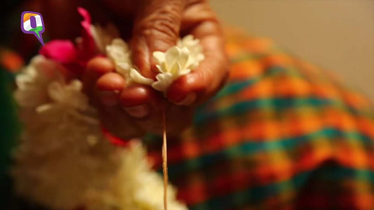 Threading flowers together, feeling and smelling each, into a Poochendu (garland), makes Usha Devi #HappyInIndia.