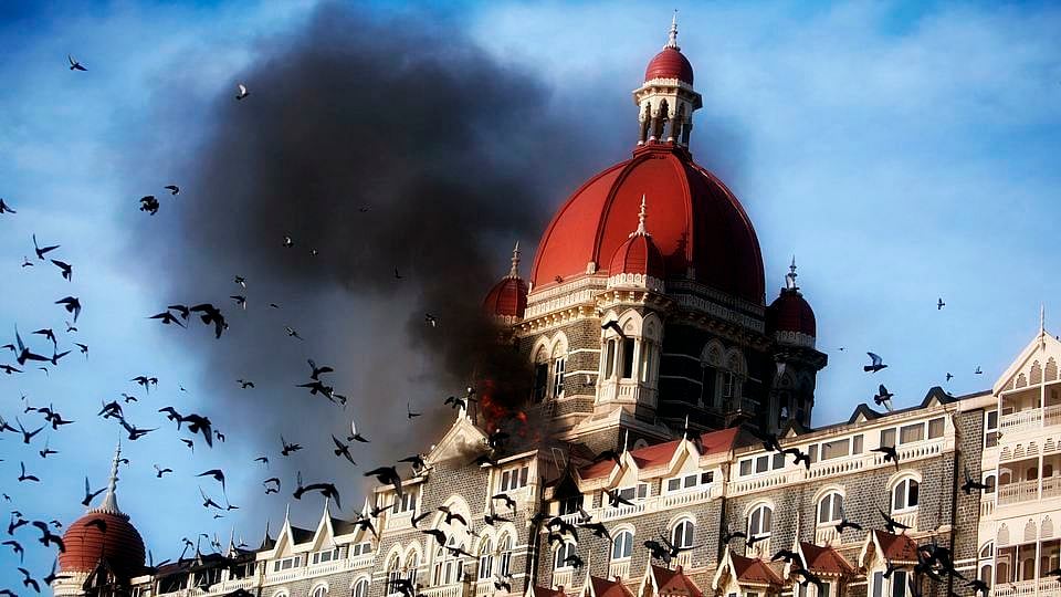 A file photo of pigeons flying near the burning Taj Mahal hotel in Mumbai in 2008. (Photo: Reuters)