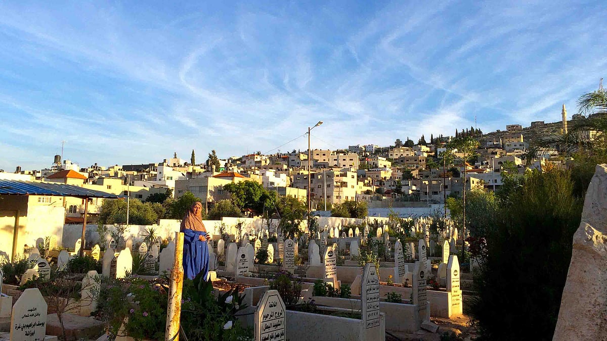 A lady visits graves at Jenin refugee camp