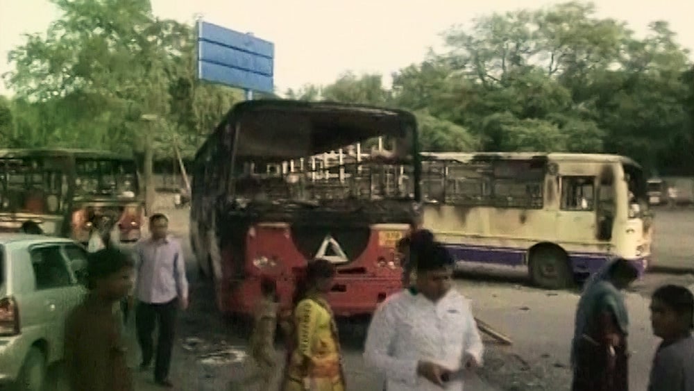 State-run buses were torched on Tuesday after Hardik Patel was briefly detained. (Courtesy: ANI)
