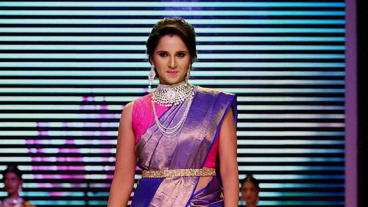 Tennis player Sania Mirza walks the ramp during a fashion show at India International Jewellery Week in Mumbai on Monday. (Photo: PTI)