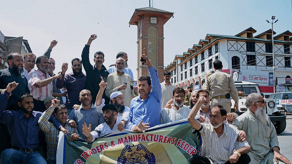 Traders and other flood victims holding a protest rally on the first anniversary of the Kashmir’s devastating floods in Srinagar on September 7, 2015. (Photo: PTI)