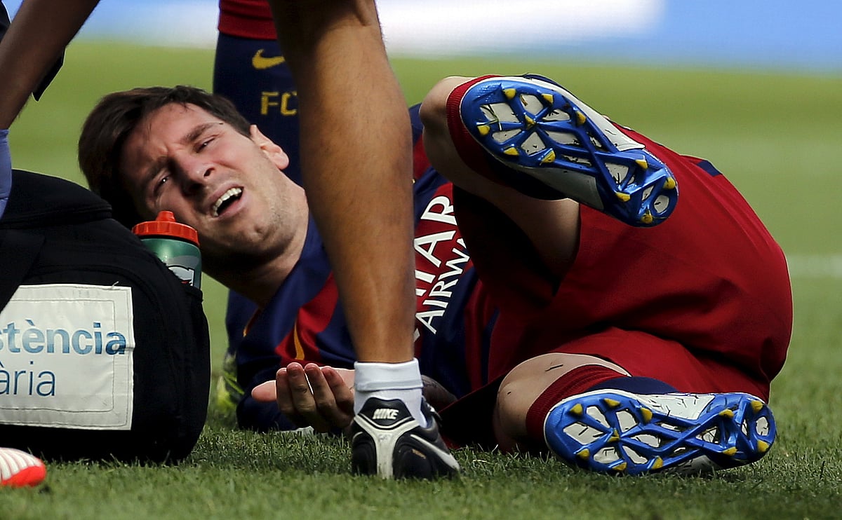 FC Barcelona’s Lionel Messi lies on the pitch injured during a Spanish La Liga soccer match against Las Palmas. (Photo: Reuters)