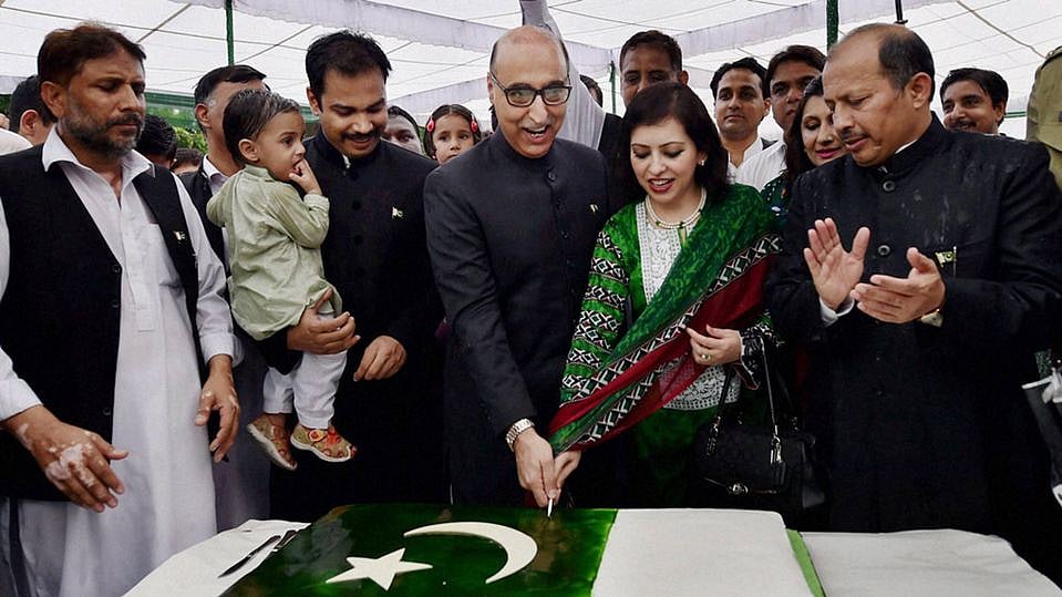 File image of Pakistan High Commissioner Abdul Basit (centre) and his wife Summiya Basit in New Delhi. (Photo: PTI)