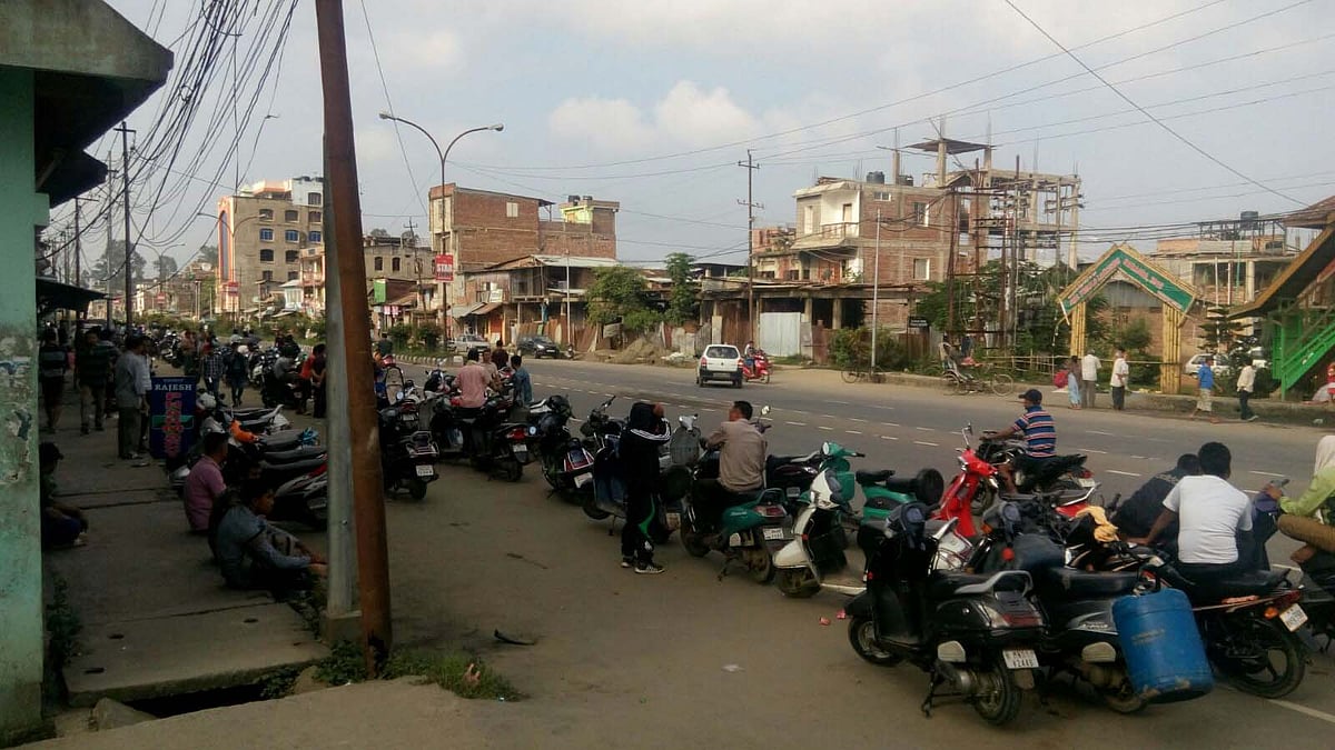 A line of bikers waiting to get their supply of petrol. (Photo: Sunzu Bachaspatimayum)