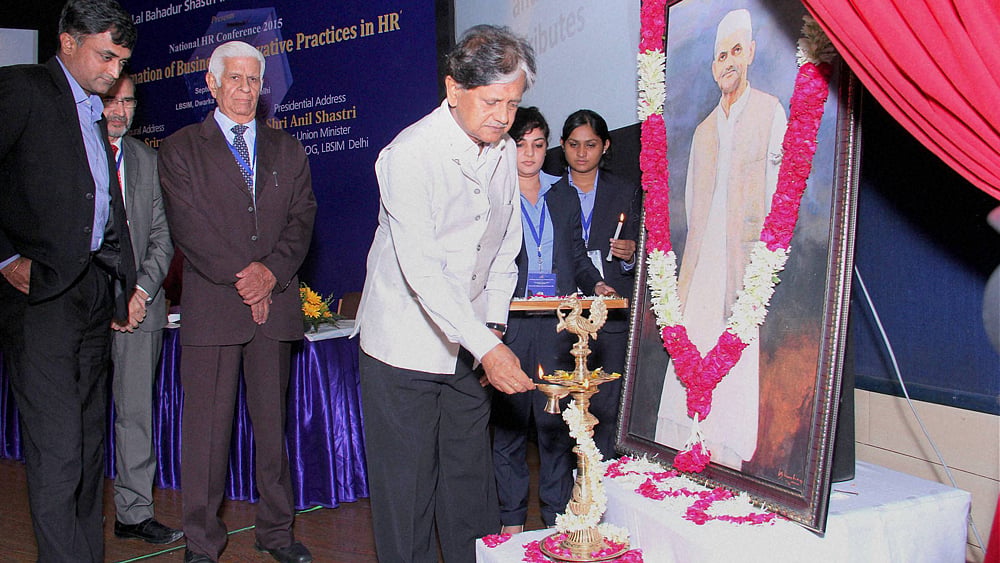 Congress leader and son of former Prime Minister Lal Bahadur Shastri, Anil Shastri, lighting lamps during a function in Delhi on September 26, 2015. (Photo: PTI)