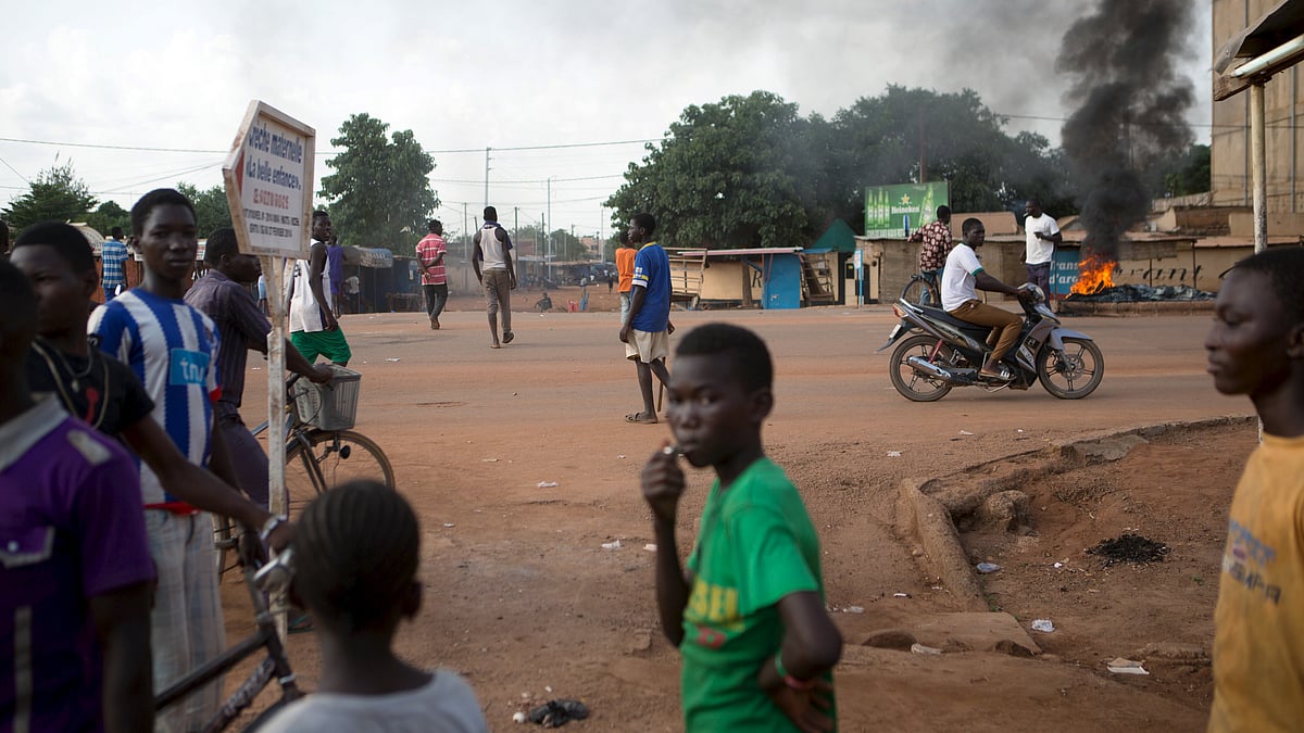 File photo of anti-coup protesters standing next to burning tires in Burkina Faso. (Photo: Reuters)