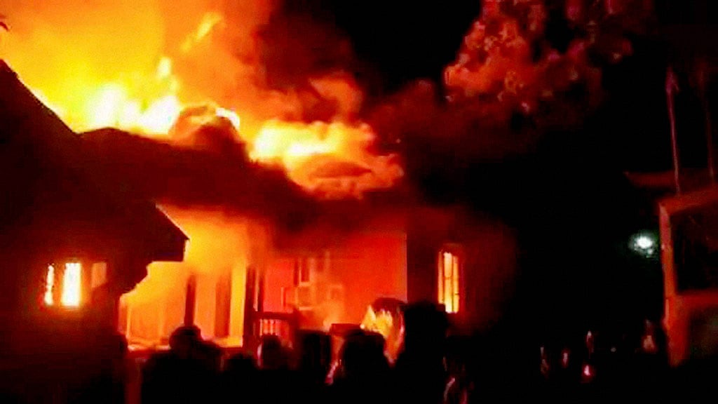 A mob set ablaze the residences of a Manipur minister and two other legislators in Imphal to protest the passage of allegedly “anti-tribal” bills. (Photo: PTI)