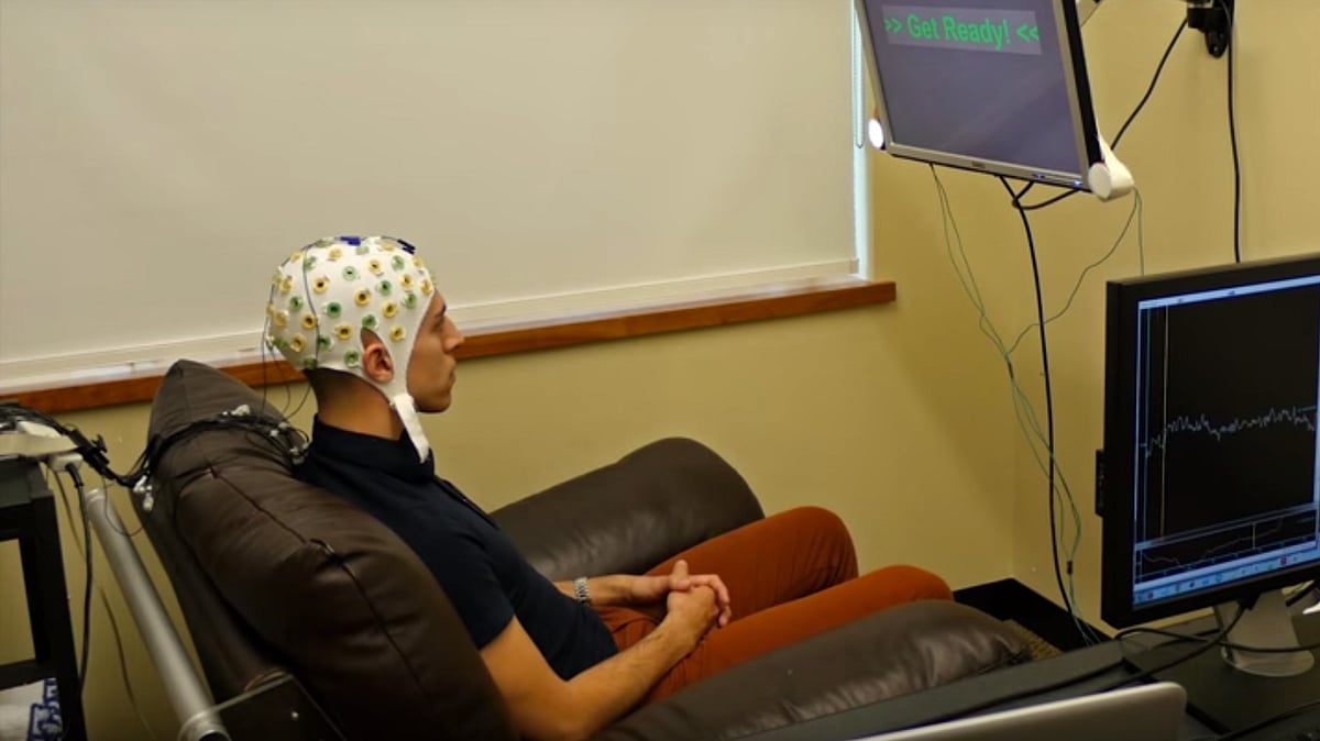 The experiment had two volunteers engaging in a quiz, sitting almost a mile apart, and communicating with their brain signals. (Photo: YouTube Screengrab)