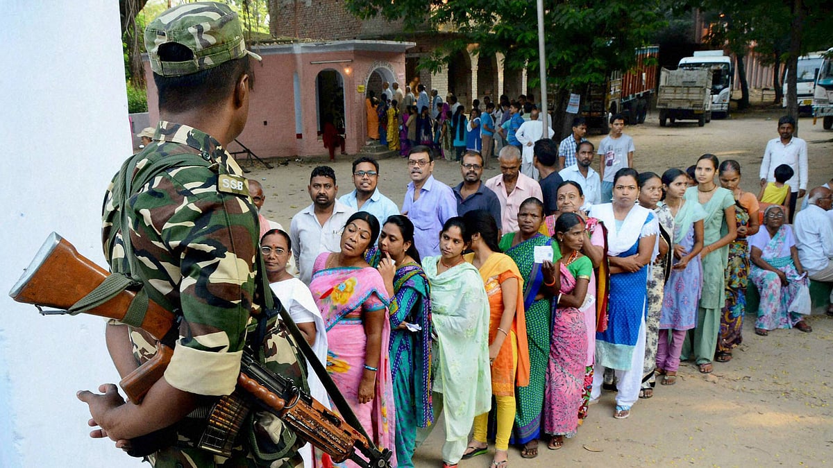 Voters wait in queues to cast their vote during the second phase of Bihar elections in Gaya, October 16, 2015. (Photo: PTI)