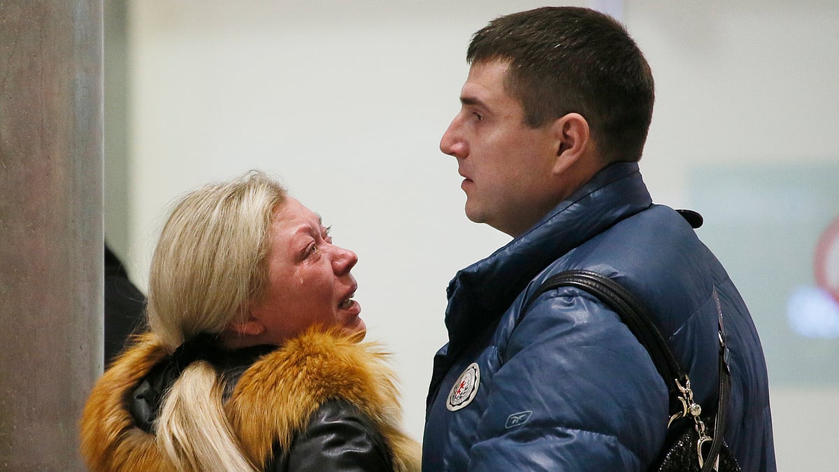 Relatives react after a Russian airliner with 217 passengers and seven crew members crashed. (Photo: AP)