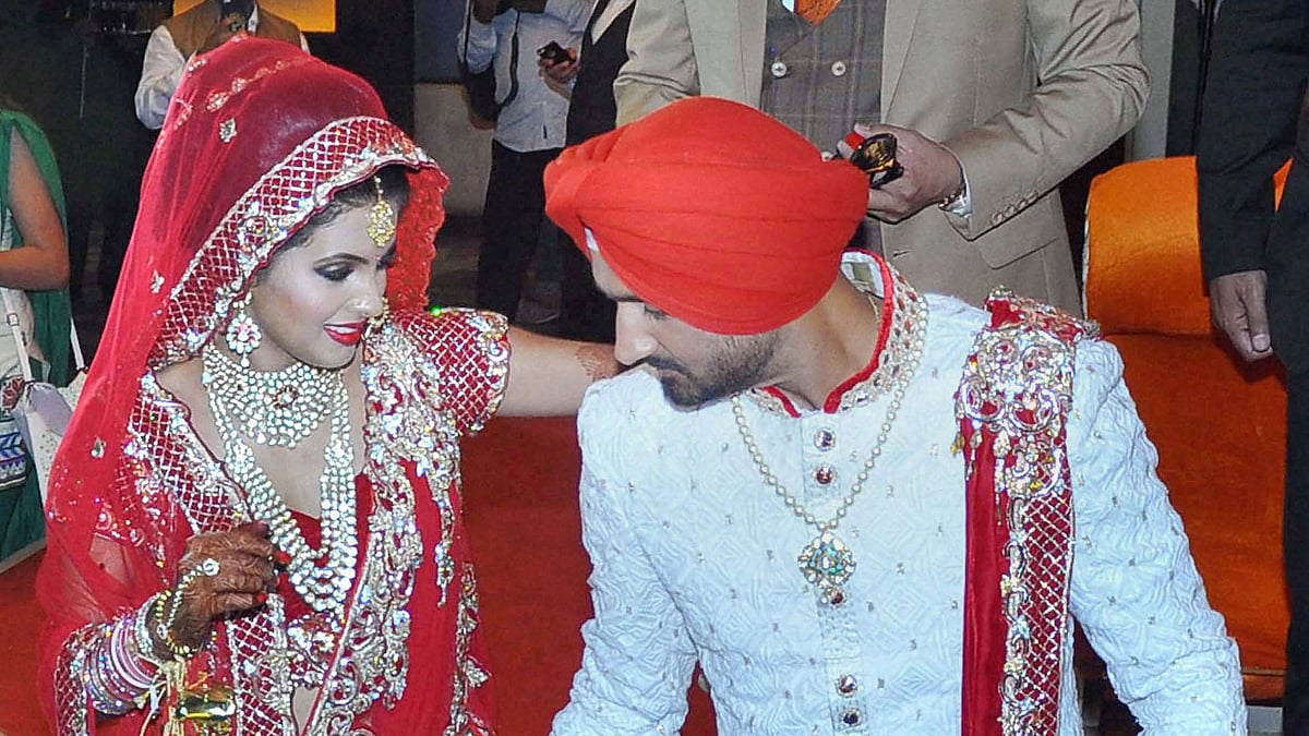 Harbhajan Singh and Geeta Basra finally tied the knot in a grand ceremony in Jalandhar on Thursday. (Photo: PTI)