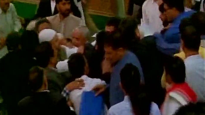 BJP MLAs beating up MLA Sheikh Abdul Rashid in J&K Assembly. (Photo: ANI)