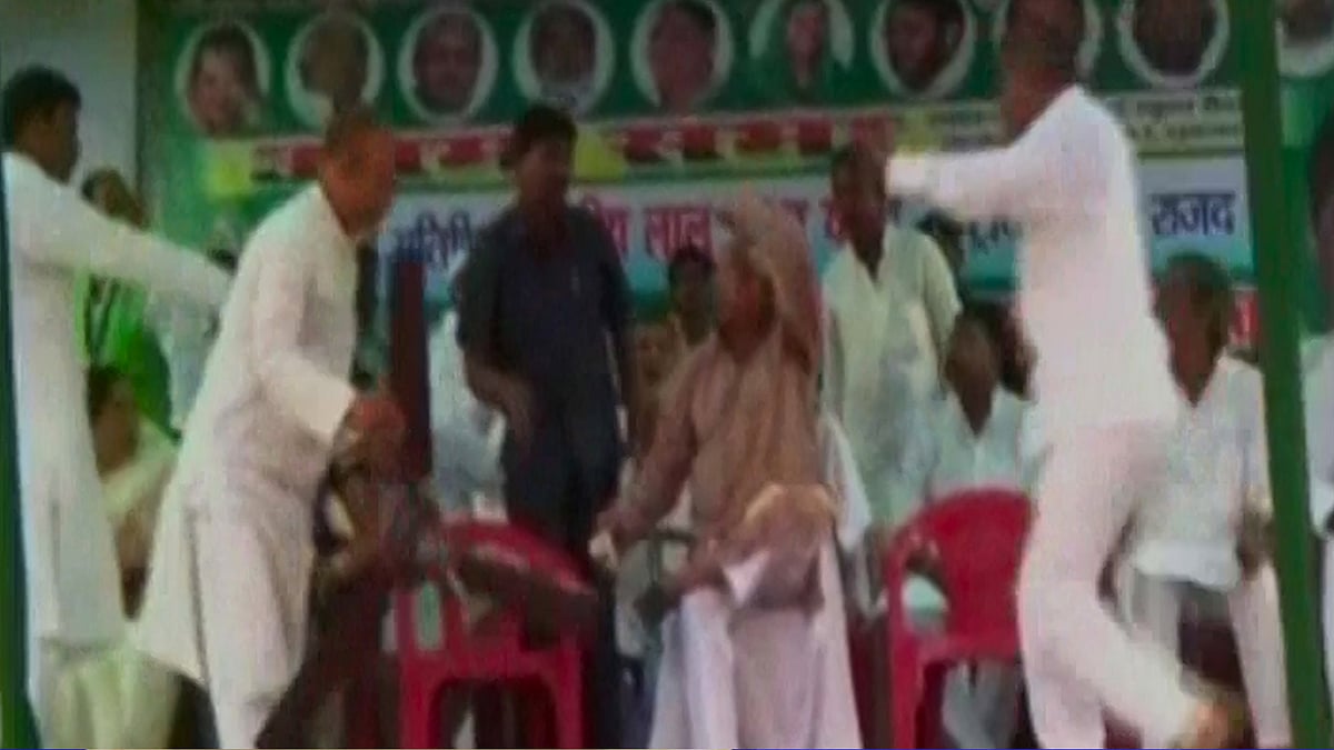 RJD chief Lalu Prasad Yadav (centre) at a rally in Motihari, Bihar where a malfunctioning ceiling fan narrowly missed falling on him. (Photo: ANI screengrab)