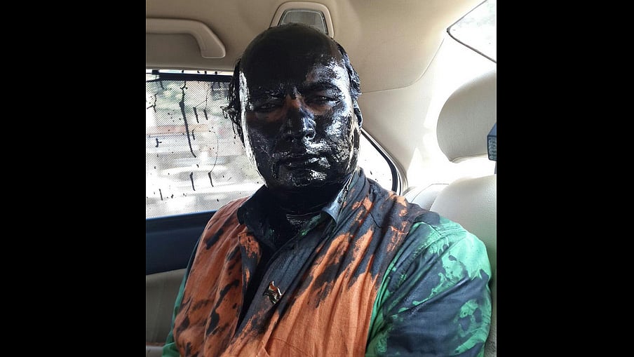 Sudheendra Kulkarni after he was attacked by Shiv Sainiks. (Courtesy: ANI screengrab)