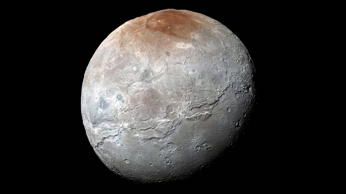 NASA’s New Horizons spacecraft captured this high-resolution enhanced color view of Pluto’s big moon Charon. (Courtesy: NASA/JHUAPL/SwRI)