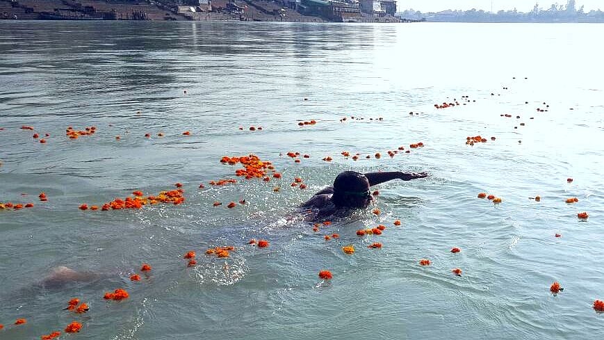 Flowers showered on Wg Cdr Paramvir as he crossed the Ram Jhula in Rishikesh.