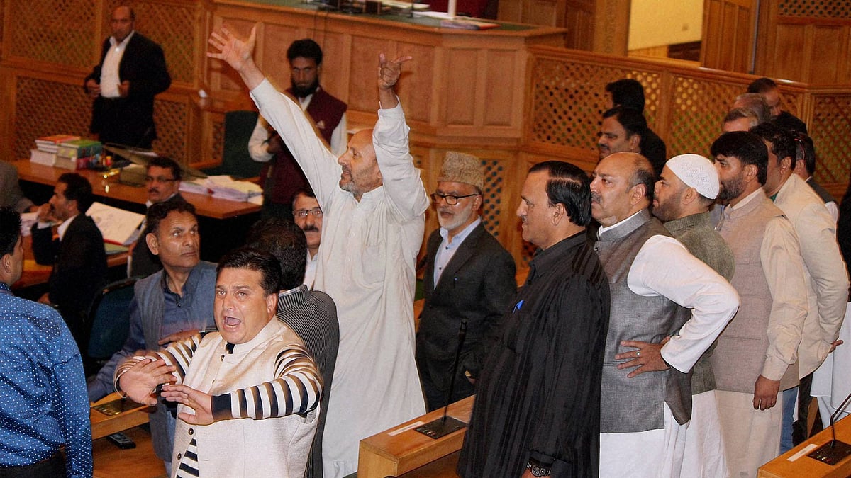 Independent MLA Engineer Rashid (with raised hands) was assaulted by BJP MLAs in the J&K Assembly today for organising a beef party in Srinagar on Wednesday. (Photo: PTI)