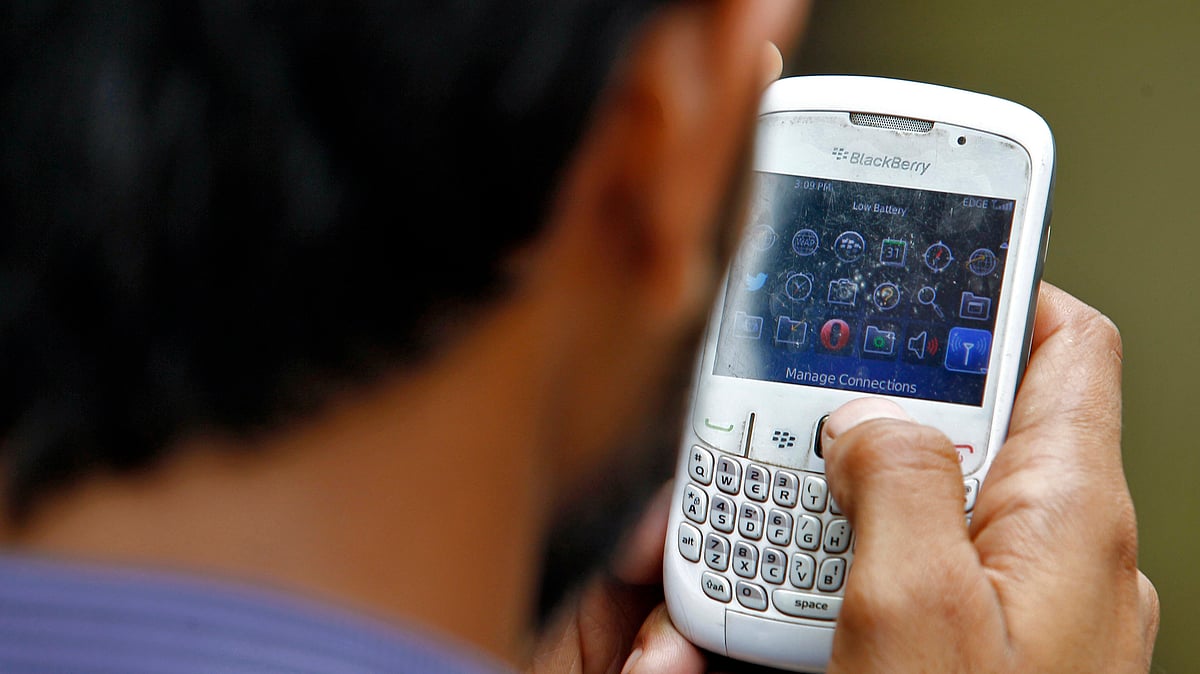 A man looks at ‘Manage Connections’ on his phone. (Photo:l Reuters)